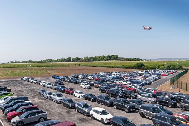 The car park in use with an aircraft overhead